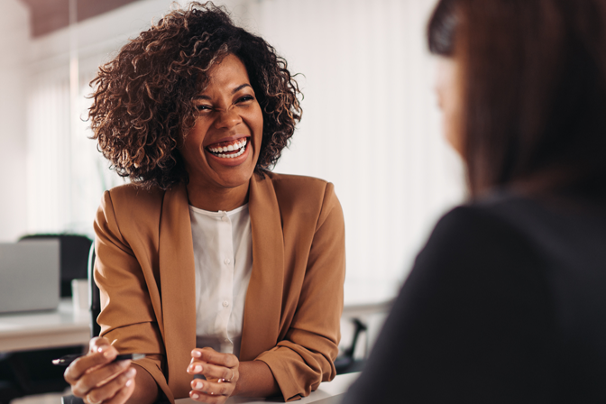 Woman smiling while helping other